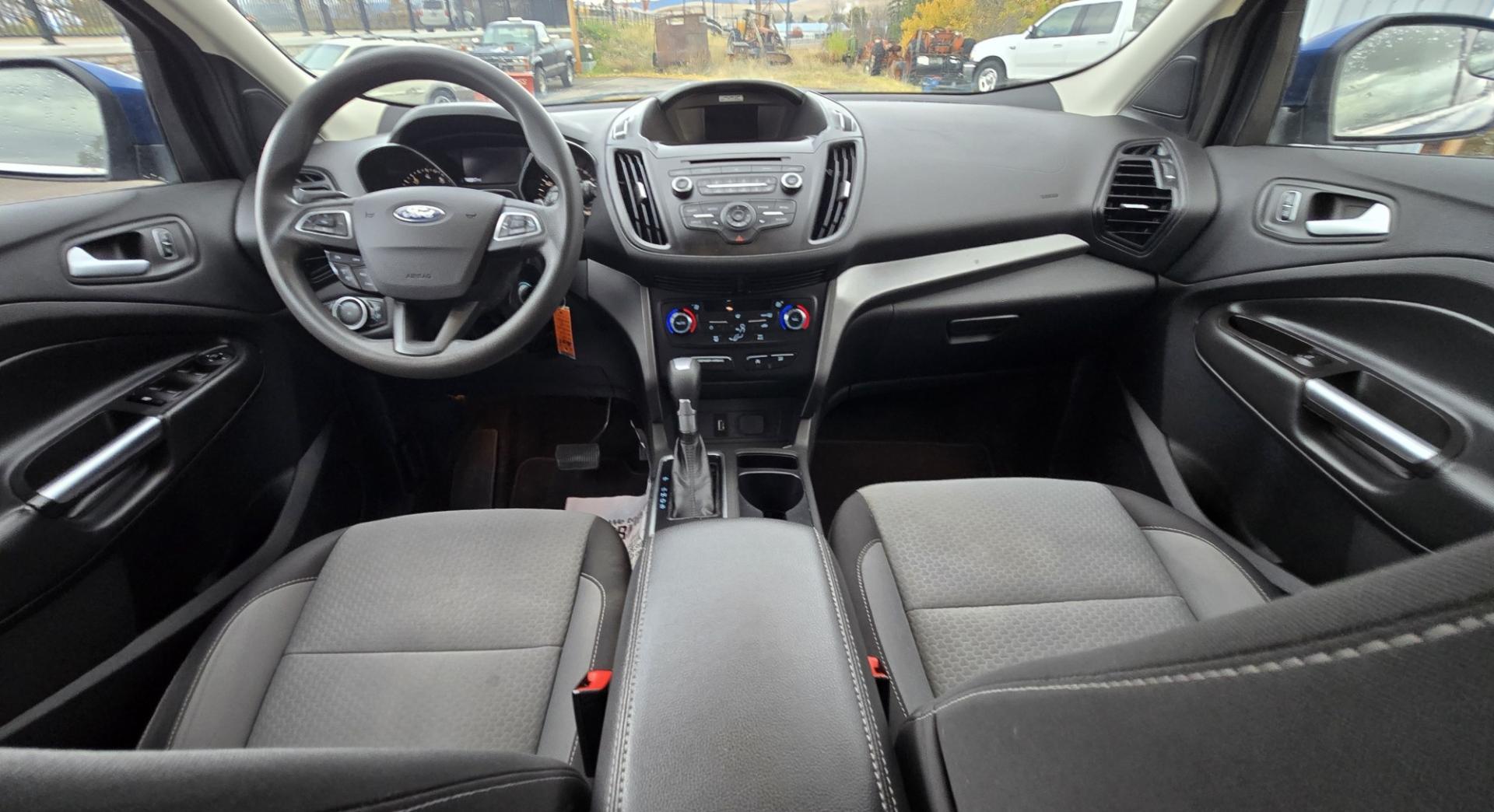 2017 Blue /Gray Ford Escape SE 4WD (1FMCU9GD9HU) with an 1.5L L4 DOHC 16V engine, 6A transmission, located at 450 N Russell, Missoula, MT, 59801, (406) 543-6600, 46.874496, -114.017433 - Cute little One Owner AWD SUV with Goodyear Tires all around. Ready for Winter Roads or Summer Cruising. Fuel Economy Friendly 1.4L I4 Engine. 6 Speed Automatic Transmission. Power Drivers Seat. Dual Climate Control. AM FM CD Player with Bluetooth Audio and Phone Connectivity. Backup Camera. Has a s- Photo#15